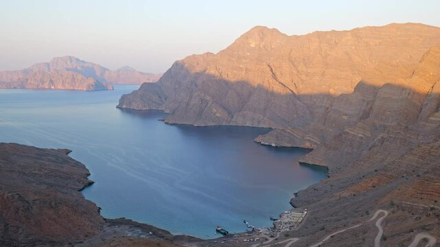 panoramic view of the Musandam fjords from a rocky cliff at sunset, Khor Najd, Oman