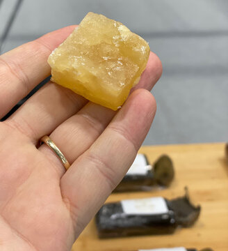 Holding up a giant block of THC extract