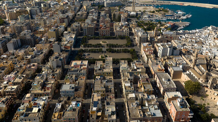 Aerial view of Piazza Vittorio Emanuele II (Victor Emmanuel II Square) in Monopoli. It is the largest square in the city with trees,fountains and gardens in the middle.