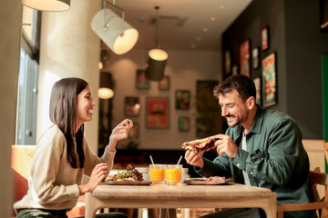 Enjoying a delightful brunch together at a cozy cafe on a sunny afternoon in the heart of the city