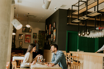Cozy conversation between two friends over drinks in a warm, inviting café during a sunny afternoon