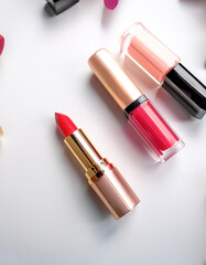 Creative concept photo of cosmetics swatches beauty products lipstick on white background