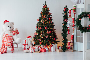 Interior with Christmas tree with gifts and toys as background New Year