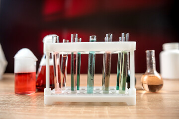Group of laboratory flasks and beaker for experiment with color liquid in science laboratory