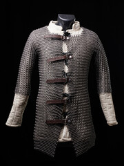 Medieval chain mail protective costume on black backgound