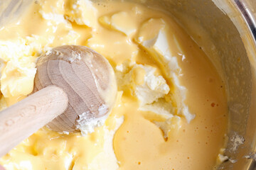 Preparing the butter for baking the cake.