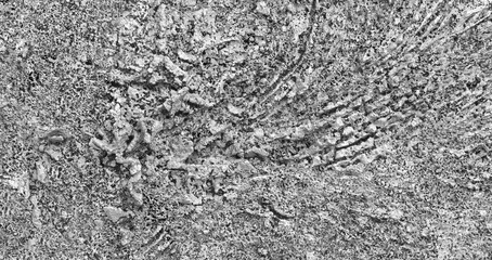 Large metal with a lot of texture and lots of small abstract details. The metal structure is very rough and has many protrusions and ridges.