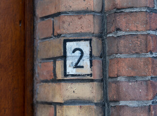 Number 2 painted on the brick wall