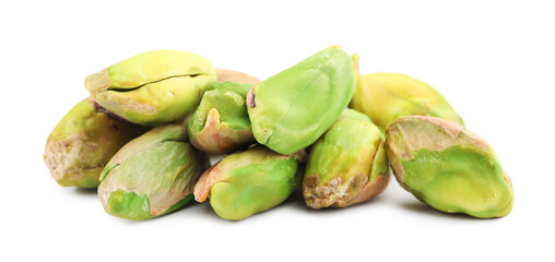 Tasty peeled pistachio nuts isolated on white
