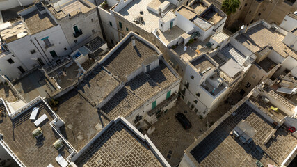 Aerial view of houses, apartments and buildings in the historic center of Monopoli, in the province...