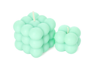 Beautiful turquoise bubble candles isolated on white