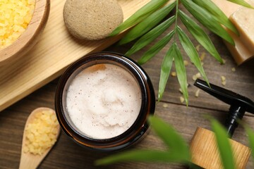 Spa composition with different cosmetic products on wooden table, flat lay