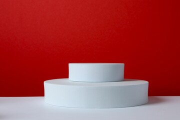 White podium on two tone background