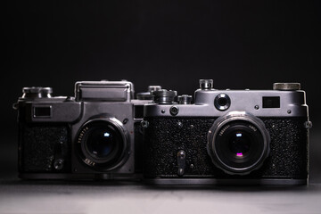 Retro cameras on black background