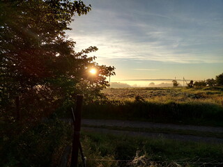 Sunrise over a foggy Ukrainian village in spring.