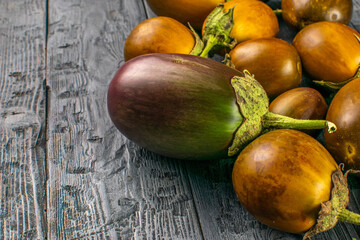 Fresh Eggplants on Rustic Wooden Background - A Natural Harvest Display