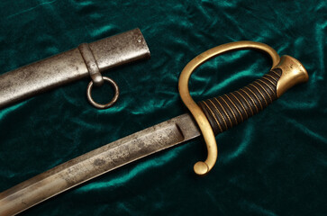 Antique English sabre on green table