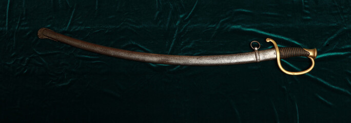 Antique English sabre on green table