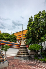 Stupa and the colorful roofs of the temple of Wat Pho in Bangkok
