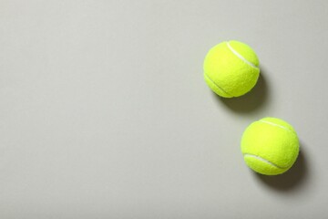 Tennis balls on gray background