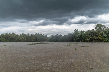 Monsoon rain and storm on the canals in Ben Tre in Vietnam