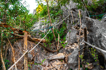 Walking hiking path way road jungle with cliff rocks Laos.