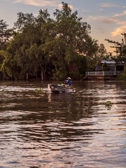 Vendors and their boats at the floating market of Phong Dien in Vietnam early in the morning