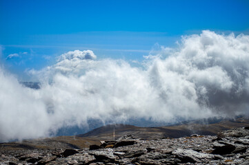Cloudy over mountains on hiking trail to Mulhacen peak, Sierra Nevada National park, Andalusia, Spain