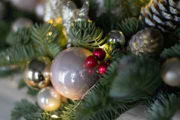Christmas floral composition of fresh Nobilis. Cotton flowers spruce, sparkling ornaments. Holiday concept. Happy New Year decorations. Ideal decoration article for office and home tables.