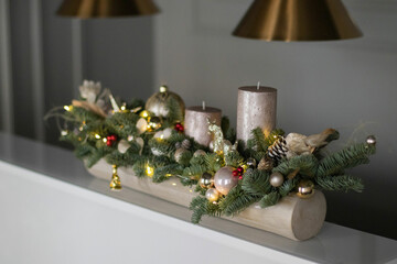 Christmas floral composition of fresh Nobilis. Cotton flowers spruce, sparkling ornaments. Holiday concept. Happy New Year decorations. Ideal decoration article for office and home tables.