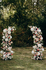 Wedding flower arch for an outdoor wedding. A floral meeting place for the bride and groom.