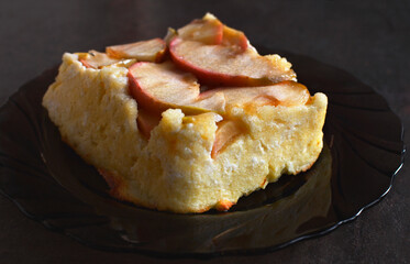 Apple Cottage Cheese Cake. Cottage cheese sweet casserole with apple layer on a plate. The blended cottage cheese gives it a smooth and velvety consistency.