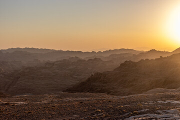 Sunset over the rocky landscape of Wadi Disah, Saudi Arabia