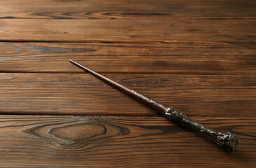 One old magic wand on wooden table