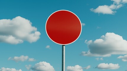 Round Red Sign Against Blue Sky and Clouds