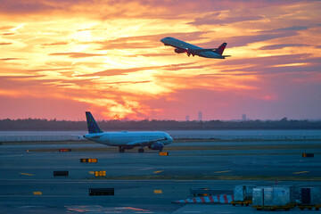 passenger plane takes off at dawn