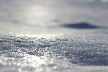 Texture of winter snow, snow shines in the sun