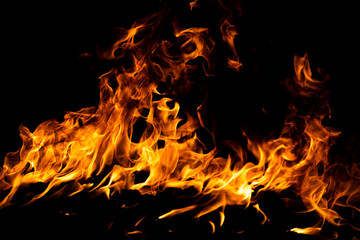 Fototapeta premium Fire flame. Burn lights on a black background.