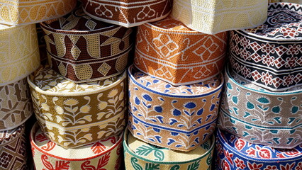  traditional Muslim headwear on a market on zanzibar