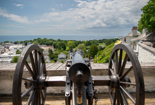 looking at mackinac shoreline over the barrel of a canon from fort mackinac