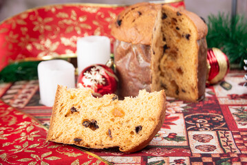Christmas table with panettone, beautiful table decorated with Christmas objects and a delicious panettone, selective focus.