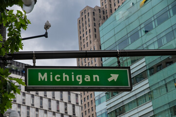 close-up of a roadsign pointing to michigan in downtown detroit