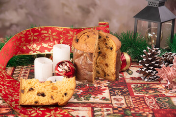 Christmas table with panettone, beautiful table decorated with Christmas objects and a delicious panettone, selective focus.