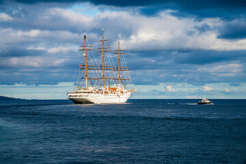 A view of a sailing ship leaving Ponta Delgada in the Azores in summertime