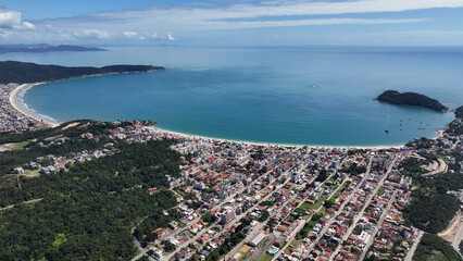 Fototapeta premium Bombinhas Skyline At Bombinhas In Santa Catarina Brazil. Beach Landscape. Nature Seascape. Travel Destination. Bombinhas Skyline At Bombinhas In Santa Catarina Brazil. Turquoise Water.