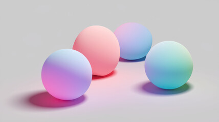 Four colorful spheres with gradient hues of pink, blue, and green, softly illuminated against a light gray background, creating a serene and modern aesthetic.