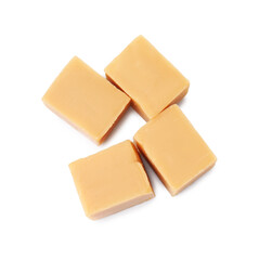 Tasty sweet caramel candies isolated on white, top view