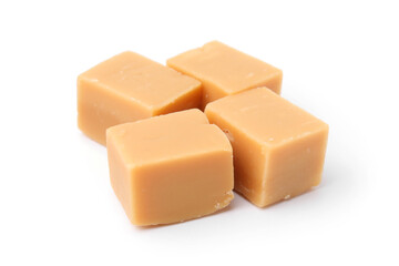 Tasty sweet caramel candies isolated on white