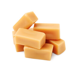 Tasty sweet caramel candies isolated on white