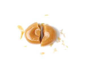 Pieces of tasty hard toffee candy isolated on white, top view